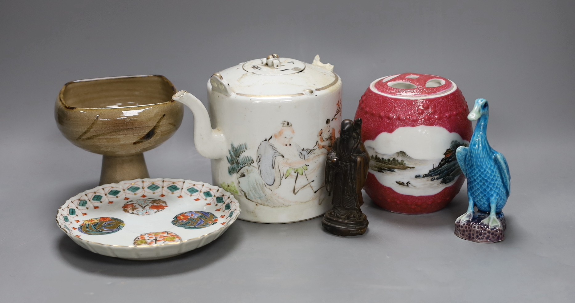 A Chinese Republic period teapot, a famille rose barrel and cover, a famille verte saucer, porcelain duck, pottery stem bowl and a resin model of Shou Lao